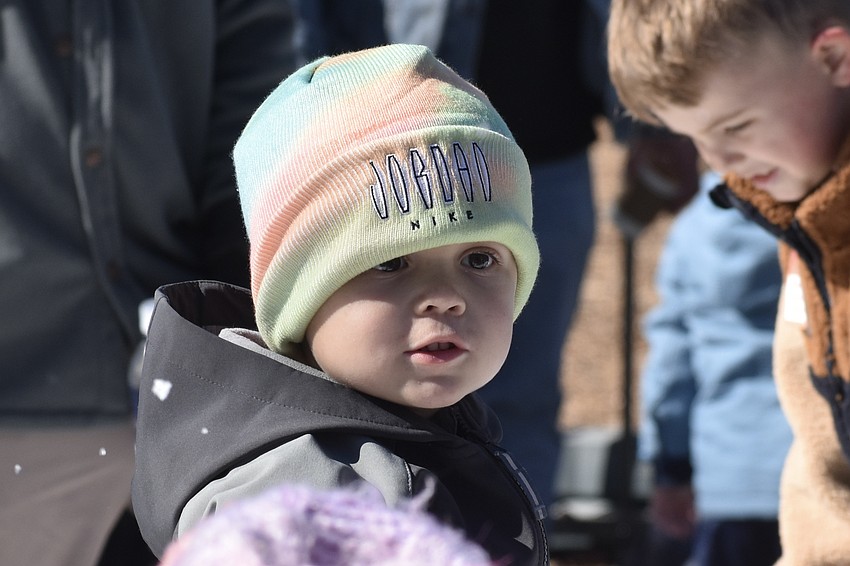 Colton Woods, 3, explores the snow scene.