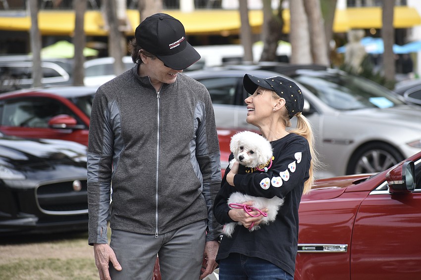 Mark Burnett, Darlene Taggart and Mia explore the cars.