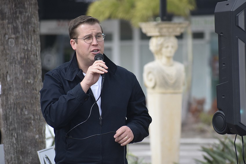 Club president Evan Eastman makes an announcement.