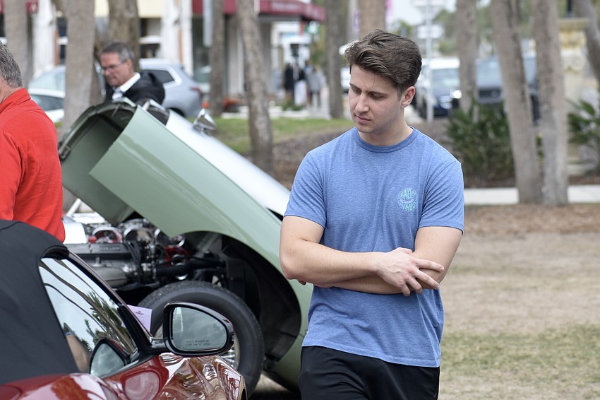 Hayden Long explores the cars.