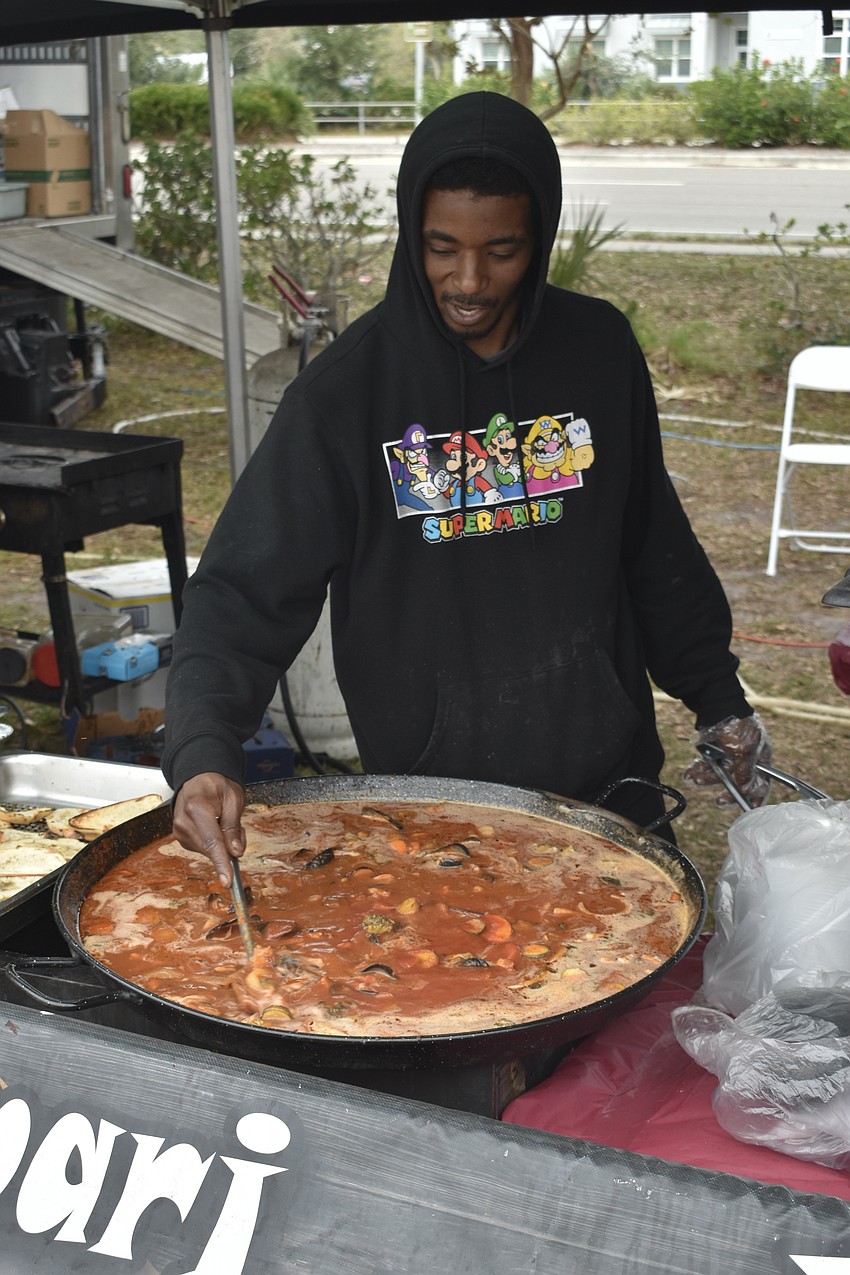 Steven Gillison mixes a stew.