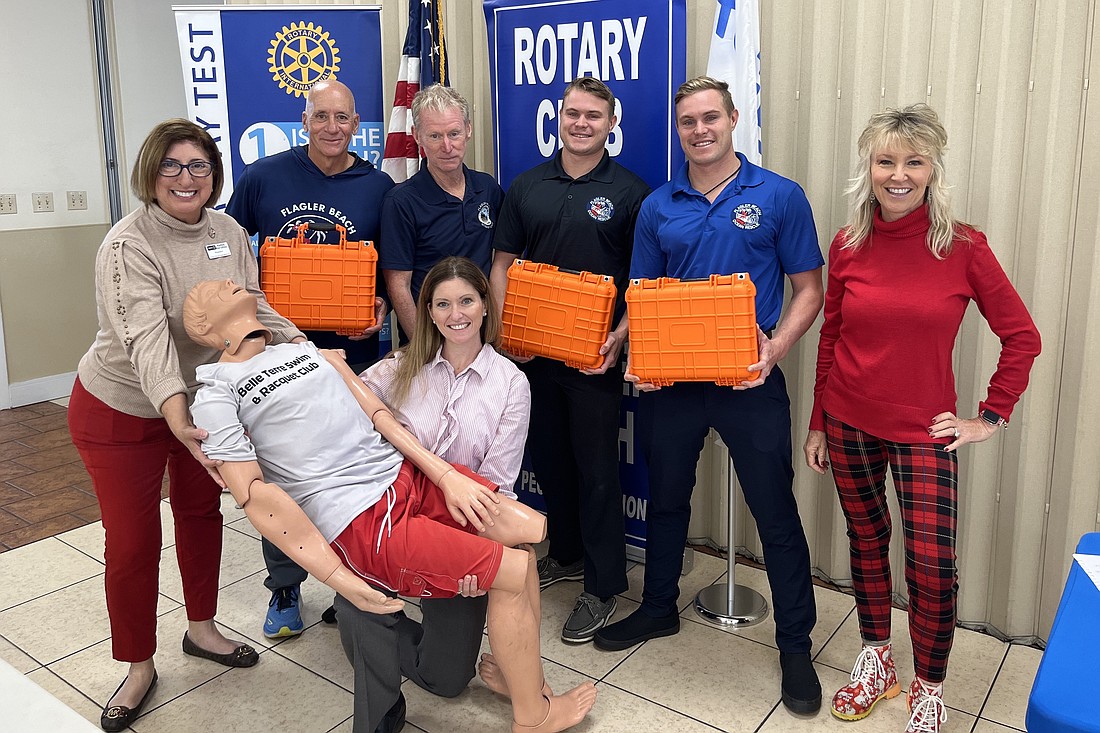 Clockwise from left: Rotary Club of Flagler Beach President Karen Pastoriza; Flagler Beach lifeguard captain Joe Armellino; Tom Gillian, head of beach patrol and surf rescue; Christian Carre, Flagler Beach firefighter/EMT; Kyle Carre, Flagler County paramedic; Cindy Dalecki, Rotary Club of Flagler Beach member; and Lauren Ramirez, owner of Salus Medical with "Bob". Courtesy photo