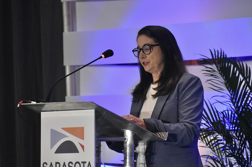 Jan W. Pitchford, managing partner of Shumaker, delivers a speech.