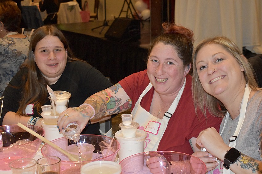 Bradenton's Morgan Chambers, Danielle Zambito and Morgan Zambito are on Step 1 of making Challah: Mix yeast in warm water.