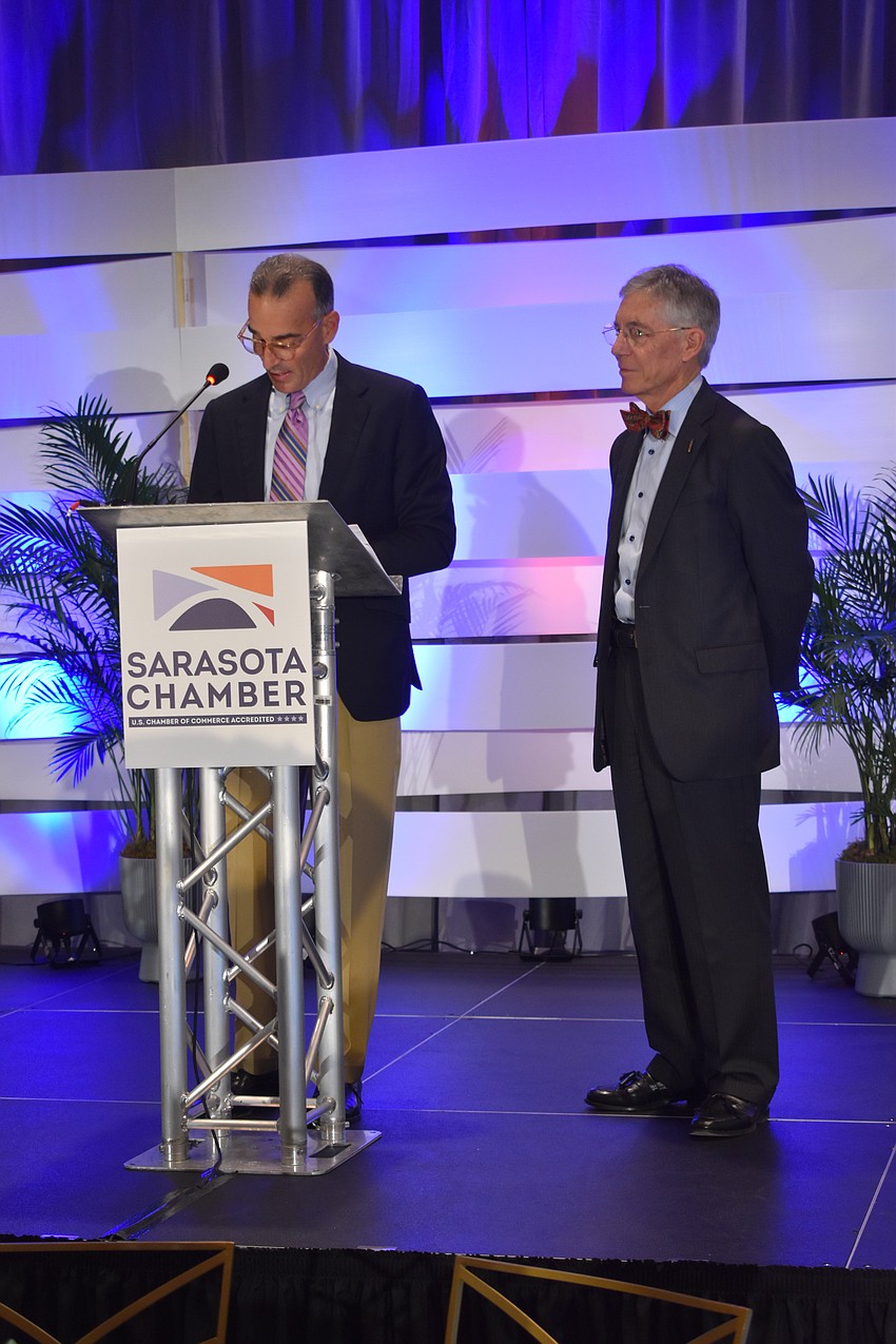 HH Staffing owner Darrin Rohr welcomes Observer Media Group founder and CEO Matt Walsh to the stage.