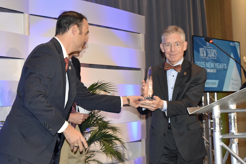 Joe Hembree hands the award to Matt Walsh.