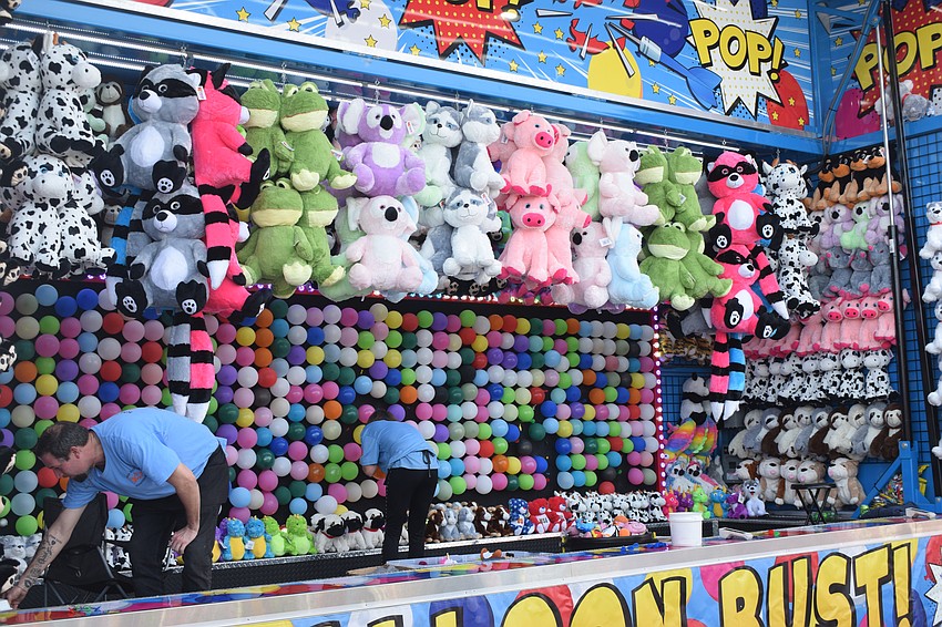 The Manatee County Fair featured several games offering prizes, including this balloon-pop game.