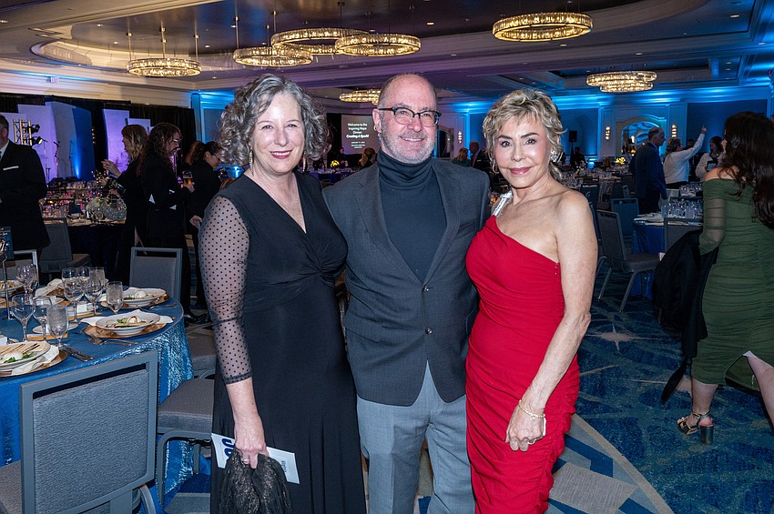 Virginia Shearer with Dr. Kirk and Chris Voelker