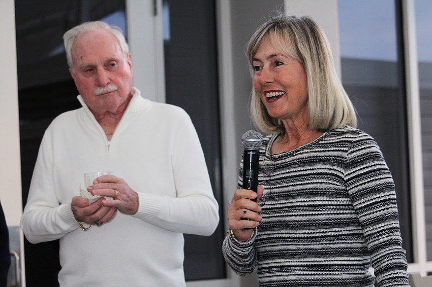 Kay Thayer thanks Rich McGrath and attendees for their recognition of her 25 years of service to the Observer Challenge tennis tournament.