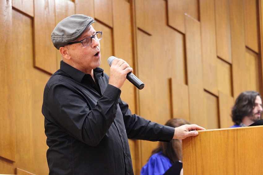 Carl Kurtyka sings 'Lean on Me' at Friday's Shabbat service at Temple Beth Israel.