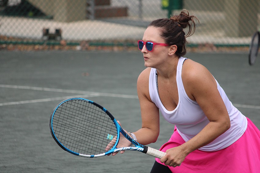 Colleen Sims keeps a close eye on the ball before the serve.