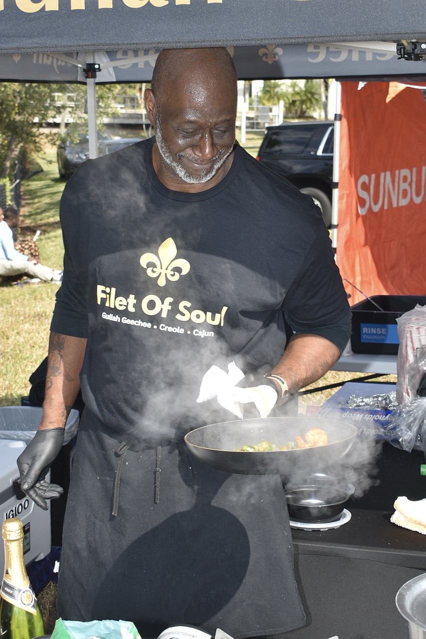 Darrell Thompson, who just founded the new business Filet of Soul, cooks up a dish that includes shrimp and okra.