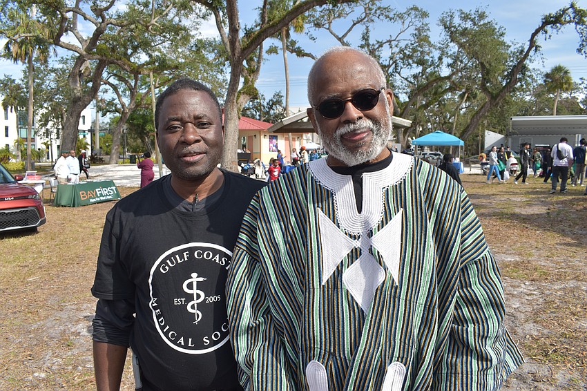 Dr. Yusif Addae, president of Gulf Coast Medical Society, which brought together the health and wellness-related vendors at the festival, poses with Dr. Washington Hill, board chair of the Sarasota African American Cultural Coalition. 