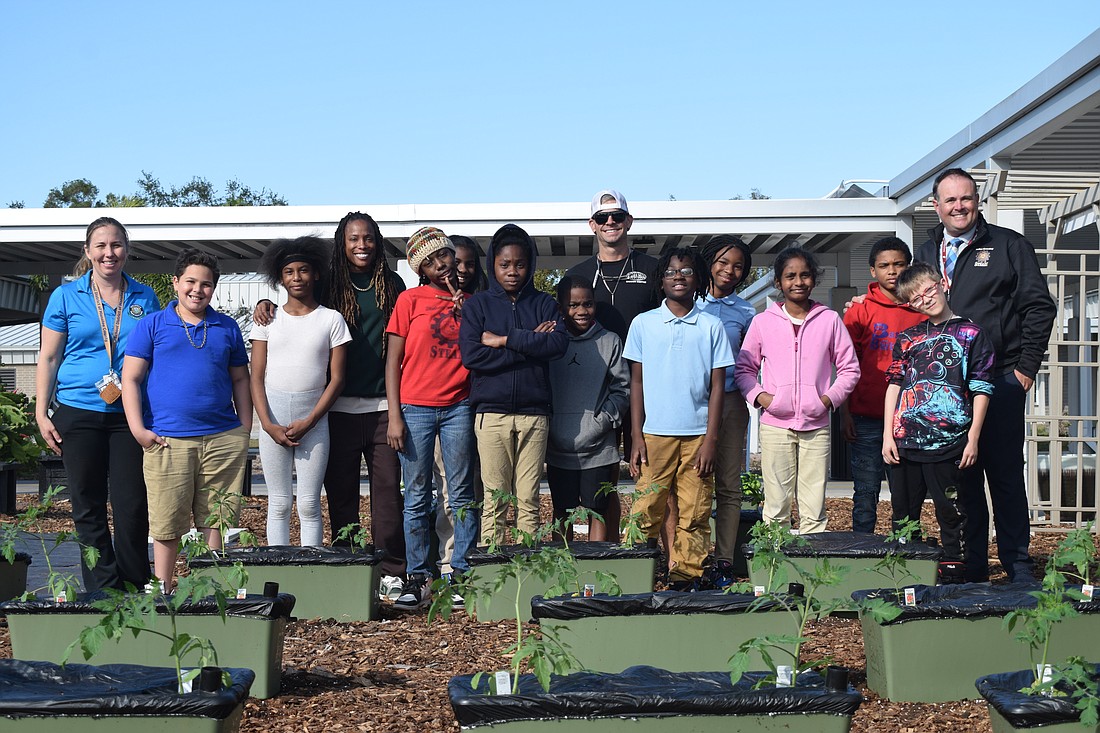 Students at William H. Bashaw Elementary School planted a new garden last week with the help from Supervisor of Student Nutrition Skye Grundy (left), EBD self-contain teacher Ms. Bratton, EarthBox representative Will Carlton and Principal James Dougherty.