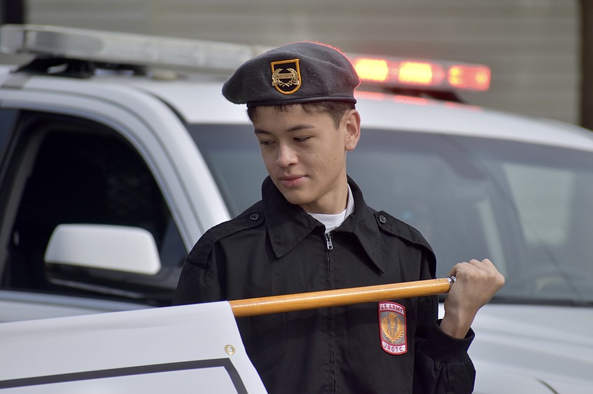 Booker High School senior, Corporal Santiago Ruiz, helps lead the JROTC squad.