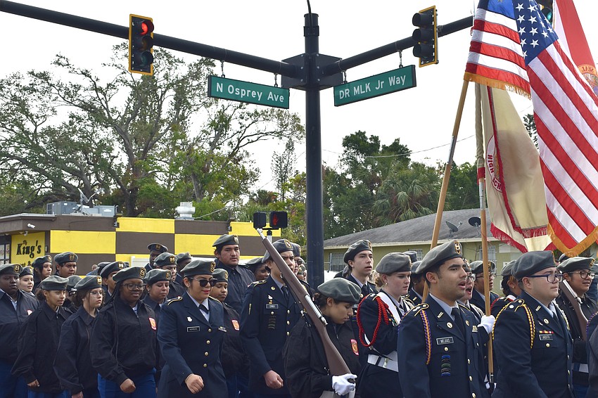 The Booker High School JROTC reaches the intersection of North Osprey Avenue and Dr. Martin Luther King Jr. Way.