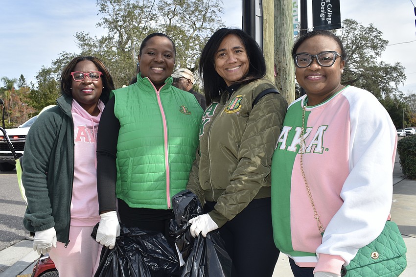 Stefante Randall, Sandra DiPentima, Ericka Randall and Latricia Gambrell of Lambda Omicron Omega, Alpha Kappa Alpha Sorority, Inc., cleaned up the park, then read books to children with Second Chance Last Opportunity, as their Day of Service Project.