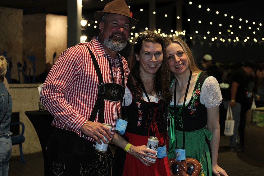 From left, Troy Schneeberger, Sarah Harnden and Sunny Dingman dress in their festive best for Sharktoberfest.