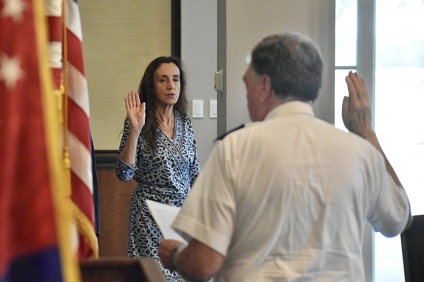 Domini Wood, a member of the new Bridge, is sworn in by Ron Jones.