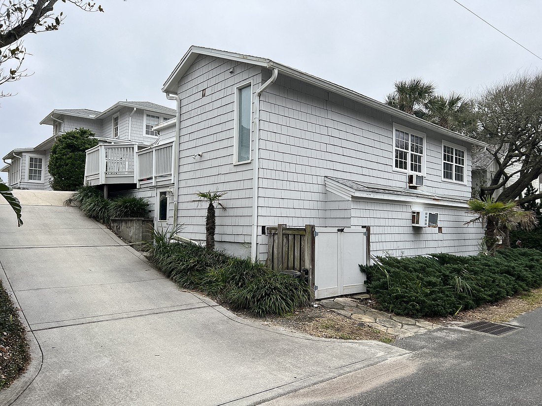 Two oceanfront two-story homes built in 1938 features seven bedrooms, six bathrooms, porch and dune walkover.