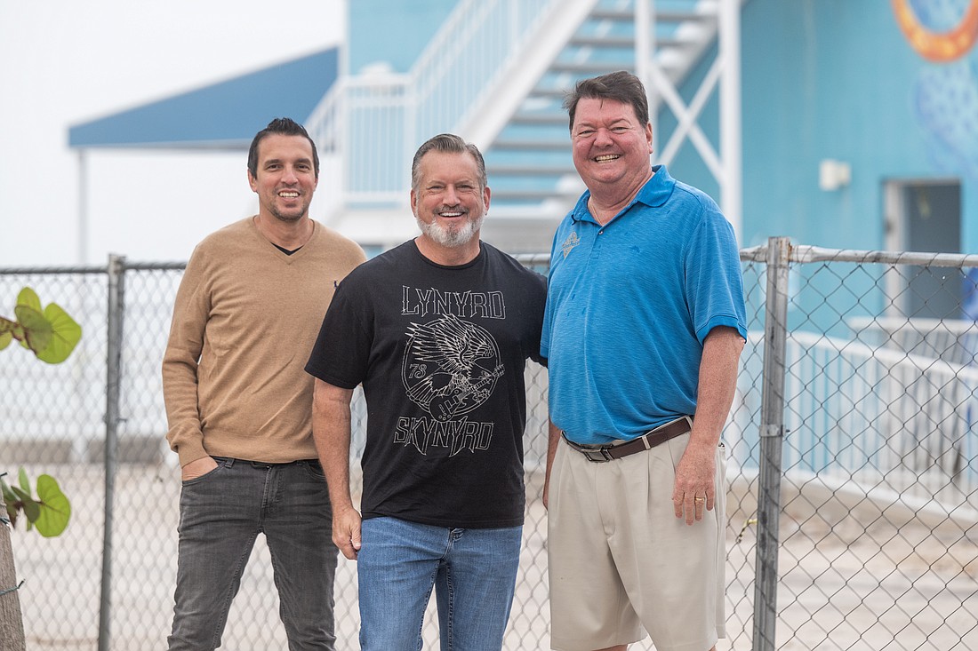 The Center of Anna Maria Island Executive Director Chris Culhane, Manatee County Commissioner Mike Rahn and Anna Maria Oyster Bar owner John Horne helped get the rock band to play a benefit concert in Manatee County.