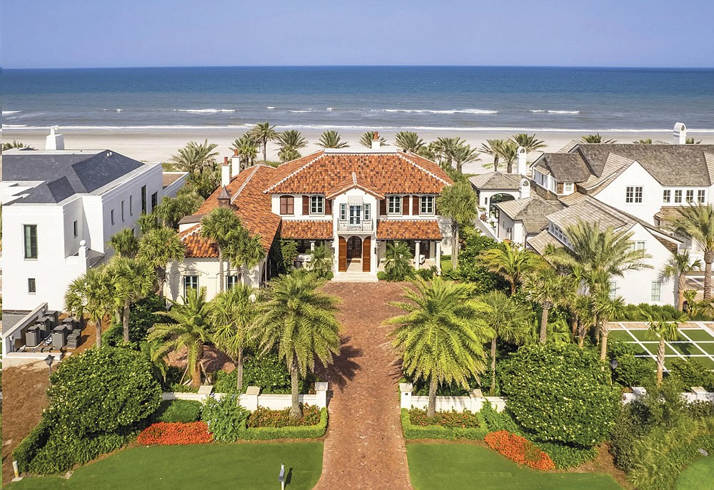 The oceanfront two-story home at 75 Ponte Vedra Blvd. features golf course views, four bedrooms, four full and two half-bathrooms, bonus room, guest suite, library, elevator, pool, porches, paver driveway and dune walkover.