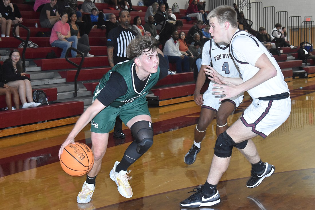 Bogdan Godlevskyi, a sophomore forward at Lakewood Ranch, drives to the basket against Braden River's Charlie Wilson on Jan. 21. Godlevskyi scored a season high 11 points in the game, which Lakewood Ranch lost 65-45.