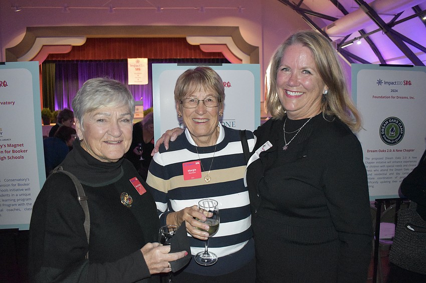 Mary Beth Grey, Margie Munson and Marilyn Keyes socialize before the event.