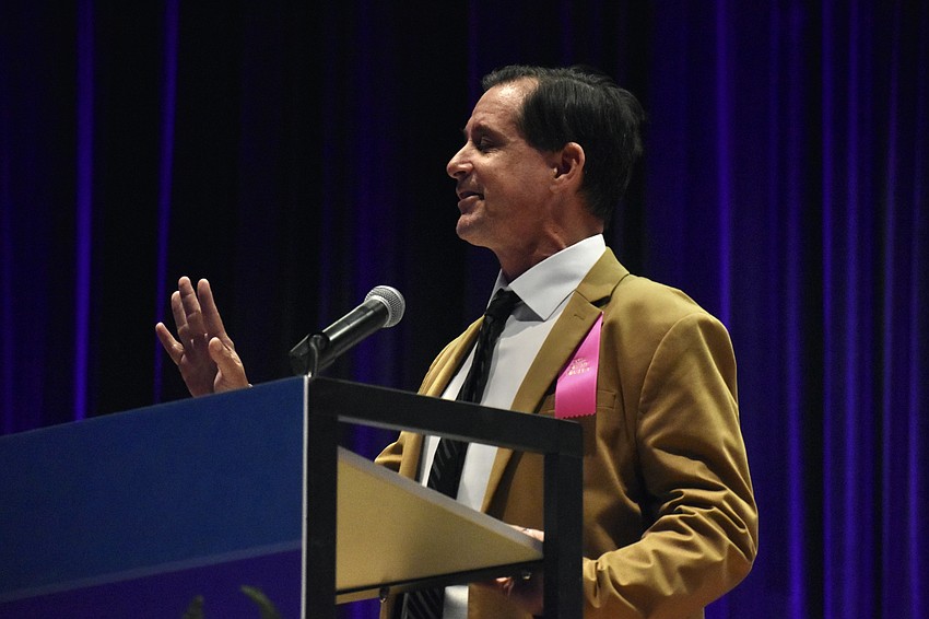 Jacob Ruscoe of Rise Above Performing Arts delivers a speech.