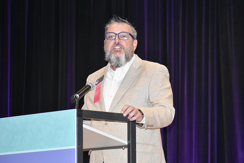 Brian Walton, executive director of Save Our Seabirds, offers a speech.