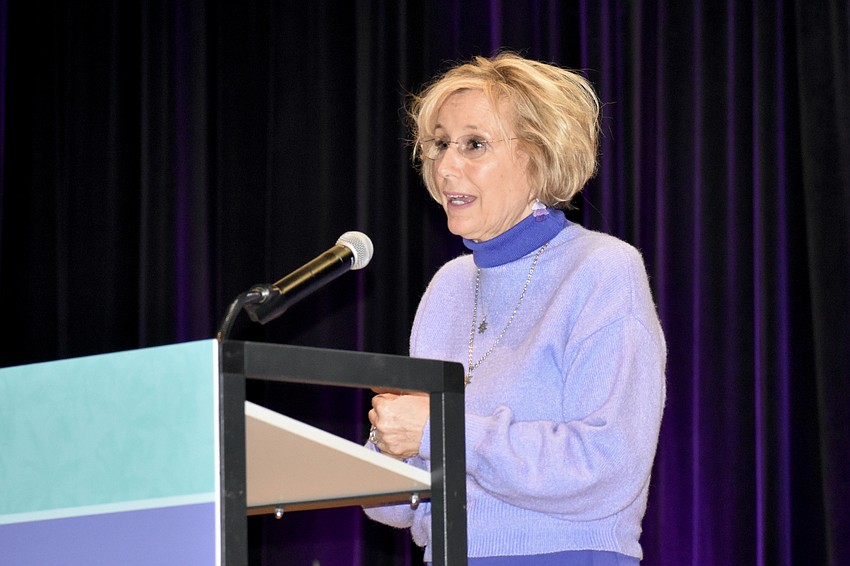 Wendy Steele, founder of the national Impact100 organization, speaks.