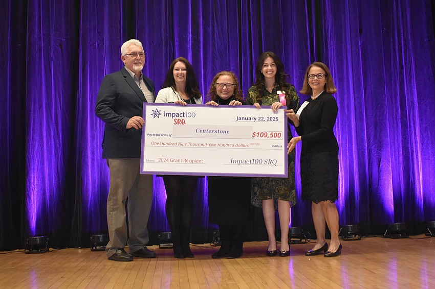 Roger Johnson, Amy Wrightson, Jayne Tingley and Victoria Tiggas of Centerstone pose with Maria Mandler of Impact100 SRQ.