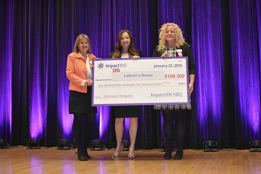Amy Strom, Angela Melvin and Tara Zajas of Valerie's House receive their grant.