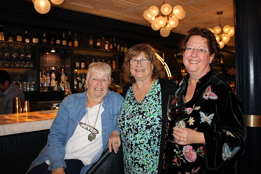 Linda Schaenk, Joanne Merrill and part-owner Amanda Horne celebrate the opening of Café on St. Armands.