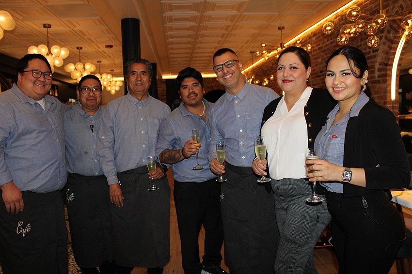 Staff members at Café on St. Armands prepare for service.