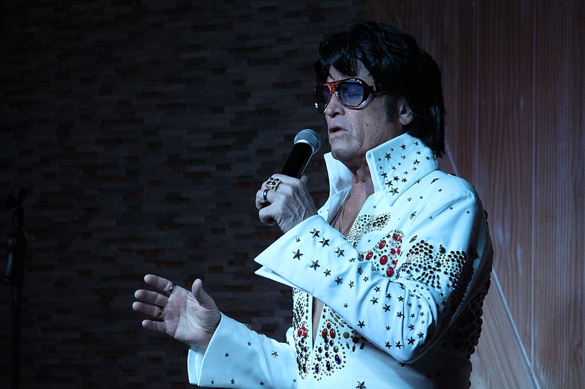 Elvis serenades the crowd.