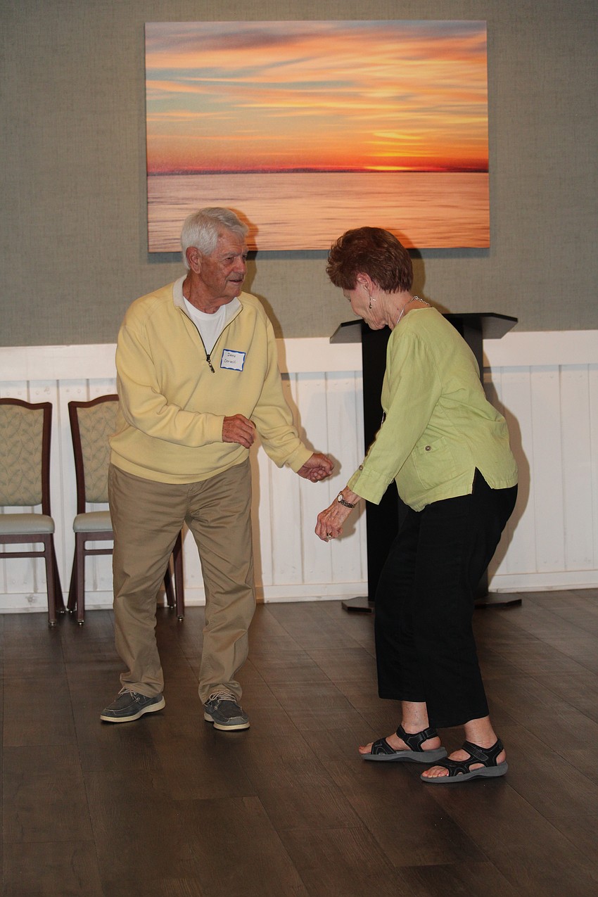 Demo Dervelli and Georgianna Vicari are some of the first people up to dance.
