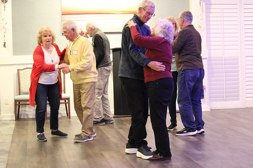 John and Karen Watson join other couples on the dance floor.