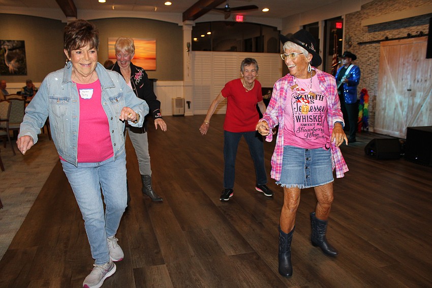 From left, Karen Talty, Sharyn Ford, Sandee Bernian and Connie DiMaggio do a line dance.