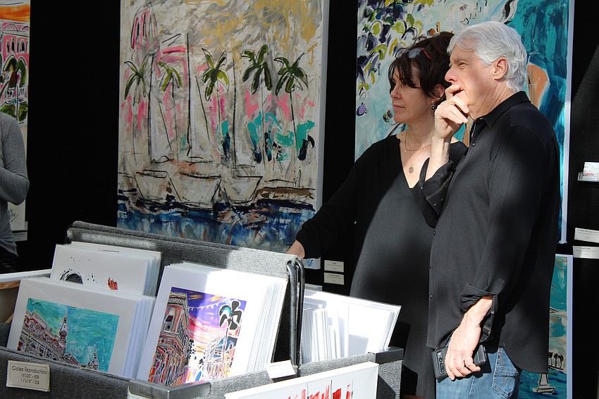 Deb Goldberg and Terry Marino take in the art.