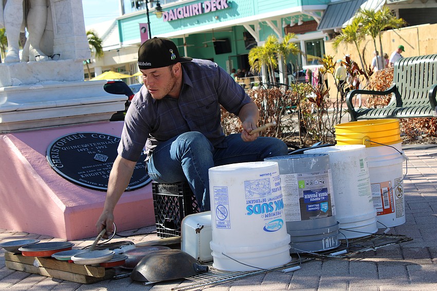 Musician Joshua Rodriguez, who goes by the name JoshOnBuckets, plays at the St. Armands Circle Art Festival.