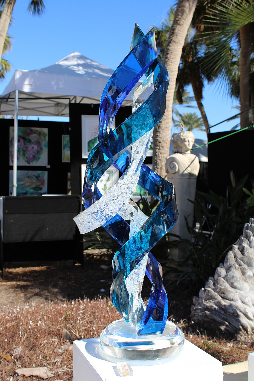 The work of Will Grant lines the walkway of the St. Armands Circle Art Festival.