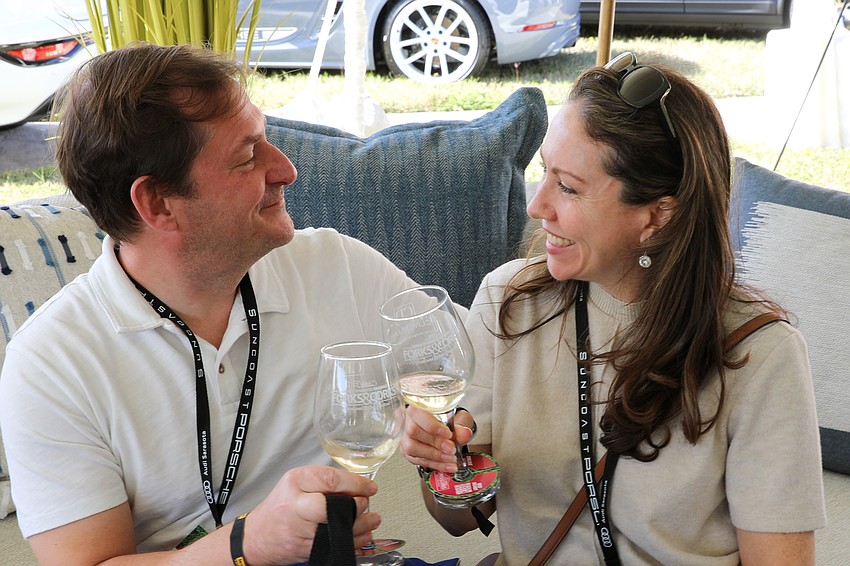 Mark Viso and Kate Gibson toast to Forks & Corks 2025.