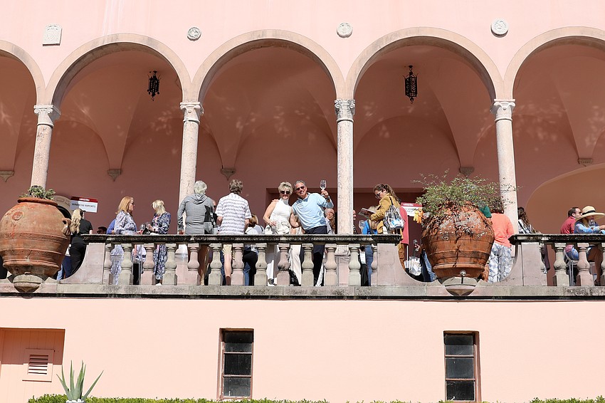 Kim and Ron Police give a wave from the top shelf.
