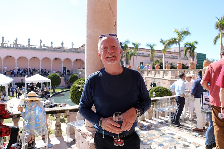 Jeff Tushar takes a shade break with his wine.