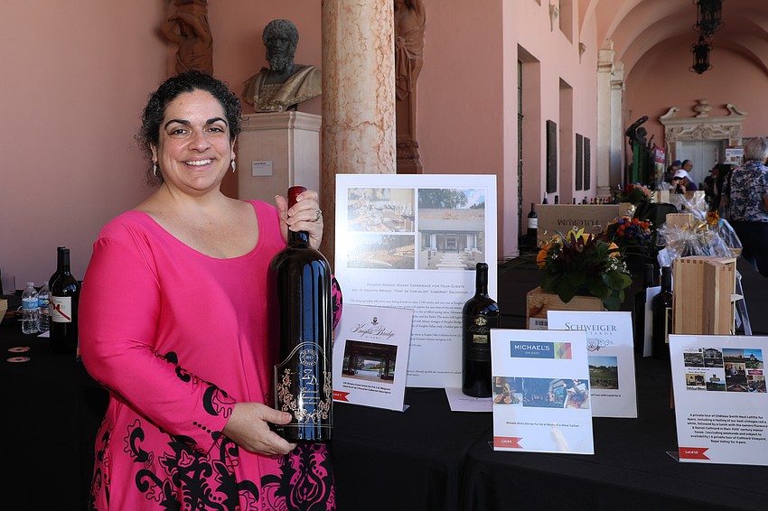 Jennifer Simms runs the silent auction for Forks & Corks.