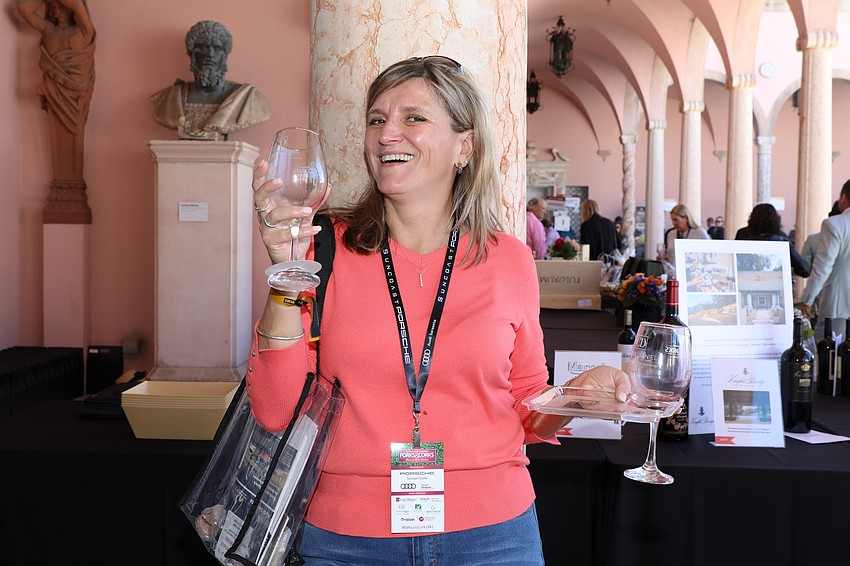 Annamaria Laszlo enjoys her wine in the shade.