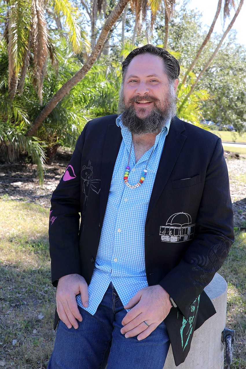 Trey Jones takes a break in the shade at Forks & Corks.