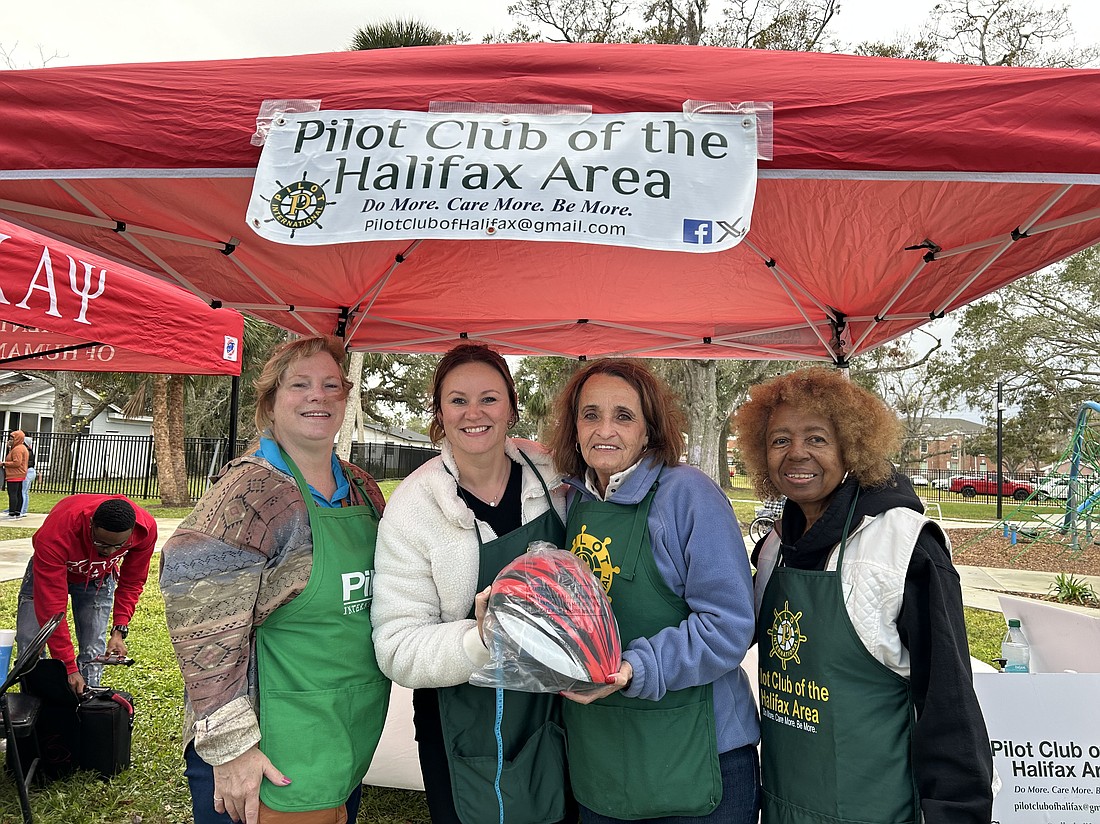 Pilot Club of the Halifax Area members provided children with free helmets during a Jan. 11 MLK resource fair in Daytona Beach. Courtesy photo