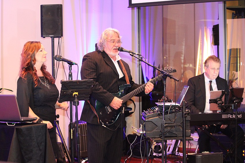 Nikki Schwanzer, John Rinell and AJ Cohen perform at the gala.